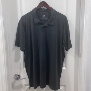 Oakley- Dark Grey, semi black colored, 2 button collared Shirt.